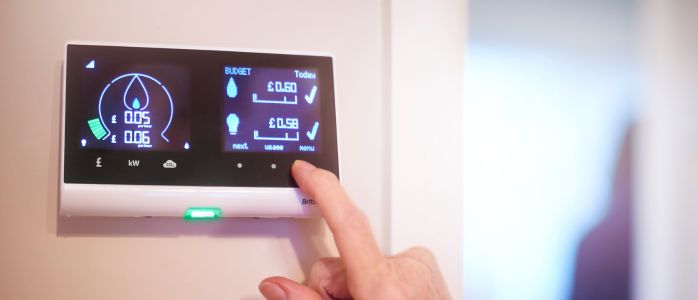 A smart meter with a green background