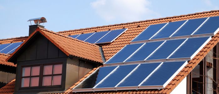 A picture of a roof with integrated solar panels and factors to consider when choosing